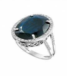 Mind-blowing women's ring in white gold 585, with brilliant-cut diamonds 0,28 ct. WVVS, and dark blue sapphire 11,2 ct., weight about 8,7 g.