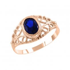 Ladies ring in 585 red gold with one sapphire